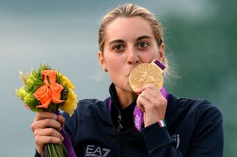 Jessica Rossi of Italy kisses her gold medal after a world-record setting performance at the Women's Trap event.