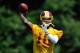 ASHBURN, VA - JULY 26: Robert Griffin III #10 of the Washington Redskins throws a pass during training camp at Redskins Park on July 26, 2012 in Ashburn, Virginia. (Photo by Patrick McDermott/Getty Images)