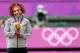 LONDON, ENGLAND - AUGUST 04: Gold medalist Serena Williams of the United States poses on the podium during the medal ceremony for the gold medal match of the Women's Singles Tennis on Day 8 of the London 2012 Olympic Games at the All England Lawn Tennis and Croquet Club on August 4, 2012 in London, England. (Photo by Clive Brunskill/Getty Images)