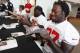 LeGarrette Blount and Davin Joseph sign autographs. (Photo courtesy of Buccaneers.com)