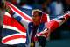 LONDON, ENGLAND - AUGUST 05: Andy Murray of Great Britain poses with his gold and silver medals holding a union jack after the medal ceremony for the Mixed Doubles Tennis on Day 9 of the London 2012 Olympic Games at the All England Lawn Tennis and Croquet Club on August 5, 2012 in London, England. (Photo by Paul Gilham/Getty Images)