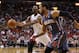 April 13, 2012; Miami, FL, USA; Miami Heat power forward Chris Bosh (1) passes the ball against Charlotte Bobcats point guard D.J. Augustin (14) in the third quarter at the American Airlines Arena. Mandatory Credit: Robert Mayer-US PRESSWIRE