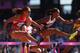 LONDON, ENGLAND - AUGUST 06: Lolo Jones of the United States jumps over a hurdle alongside Phylicia George of Canada in the Women's 100m Hurdles heat on Day 10 of the London 2012 Olympic Games at the Olympic Stadium on August 6, 2012 in London, England. (Photo by Hannah Johnston/Getty Images)