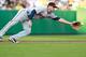 PITTSBURGH, PA - JUNE 19: Trevor Plouffe #24 of the Minnesota Twins just misses reaching for a ground ball against the Pittsburgh Pirates during the game on June 19, 2012 at PNC Park in Pittsburgh, Pennsylvania. (Photo by Jared Wickerham/Getty Images)