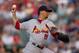 DENVER, CO - JULY 31: Starting pitcher Kyle Lohse #26 of the St. Louis Cardinals delivers to home plate during the first inning against the Colorado Rockies at Coors Field on July 31, 2012 in Denver, Colorado. (Photo by Justin Edmonds/Getty Images)