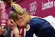 LONDON, ENGLAND - AUGUST 02: Victoria Komova of Russia reacts after finishing in second and winning the silver medal in the Artistic Gymnastics Women's Individual All-Around final on Day 6 of the London 2012 Olympic Games at North Greenwich Arena on August 2, 2012 in London, England. (Photo by Ronald Martinez/Getty Images)