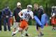 LAKE FOREST, IL - MAY 12: Defensive end Shea McClellin #99 of the Chicago Bears (C) works out with defensive line coach Mike Phair (R) and defensive coordinator Rod Marinelli during rookie minicamp at Halas Hall on May 12, 2012 in Chicago, Illinois. McClellin was the Bear's first round draft choice for the 2012 draft. (Photo by Brian Kersey/Getty Images)