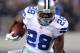 ARLINGTON, TX - DECEMBER 11: Running back Felix Jones #28 of the Dallas Cowboys runs the ball as he break a tackle by Antrel Rolle #26 of the New York Giants for a 26-yard gain in the first quarter at Cowboys Stadium on December 11, 2011 in Arlington, Texas. (Photo by Ronald Martinez/Getty Images)