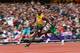 LONDON, ENGLAND - AUGUST 07: Usain Bolt of Jamaica leads Noah Akwu of Nigeria in the Men's 200m Round 1 Heats on Day 11 of the London 2012 Olympic Games at Olympic Stadium on August 7, 2012 in London, England. (Photo by Michael Steele/Getty Images)