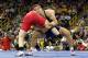 April 21, 2012; Iowa City, IA, USA; Tommy Rowlands (blue) takes down Jake Varner (red) during the 96kg freestyle match at Carver Hawkeye Arena. Mandatory Credit: Reese Strickland-US PRESSWIRE