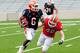 Apr 14, 2012; Champaign, IL, USA; Illinois Fighting Illini running back Josh Ferguson (6) tries to avoid being tackled by Illinois Fighting Illini linebacker Henry Dickinson (48) during the first half of the spring game at Memorial Stadium. Mandatory Credit: Bradley Leeb-US PRESSWIRE