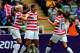 NEWCASTLE UPON TYNE, ENGLAND - AUGUST 03: Abby Wambach #14 of USA celebrates with her team-mates Megan Rapinoe (L) and Alex Morgan after scoring against New Zealand during the Women's Football Quarter Final match between United States and New Zealand, on Day 7 of the London 2012 Olympic Games at St James' Park on August 3, 2012 in Newcastle upon Tyne, England. (Photo by Stanley Chou/Getty Images)