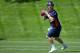 ENGLEWOOD, CO - MAY 21: Quarterback Peyton Manning #18 of the Denver Broncos drops back during organized team activities at Dove Valley on May 21, 2012 in Englewood, Colorado. (Photo by Justin Edmonds/Getty Images)