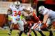 LINCOLN, NE - OCTOBER 8: Running back Carlos Hyde #34 of the Ohio State Buckeyes runs past cornerback Andrew Green #11 of the Nebraska Cornhuskers and linebacker Lavonte David #4 of the Nebraska Cornhuskers during their game at Memorial Stadium October 8, 2011 in Lincoln, Nebraska. Nebraska Defeated Ohio State 34-27. (Photo by Eric Francis/Getty Images)