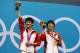 LONDON, ENGLAND - JULY 31: (L-R) Gold Medallists Chen Roulin and Hao Wang and of China pose on the podium during the medal ceremony for the Women's Synchronised 10m Platform Diving on Day 4 of the London 2012 Olympic Games at the Aquatics Centre on July 31, 2012 in London, England. (Photo by Clive Rose/Getty Images)