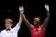 LONDON, ENGLAND - AUGUST 09: Referee Kheira Sidi Yakoub (L) announces Claressa Shields (R) of the United States winner over Nadezda Torlopova of Russia during the Women's Middle (75kg) Boxing final bout on Day 13 of the London 2012 Olympic Games at ExCeL on August 9, 2012 in London, England. (Photo by Scott Heavey/Getty Images)