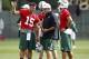 CORTLAND, NY - JULY 27: Matt Cavanaugh, quarterbacks coach of the New York Jets talks with Mark Sanchez #6 and Tim Tebow #15 of the New York Jets at Jets Training Camp at SUNY Cortland on July 27, 2012 in Cortland, New York. (Photo by Jeff Zelevansky/Getty Images)