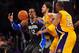 March 14, 2011; Los Angeles, CA, USA; Orlando Magic center Dwight Howard (12) loses control of the ball against the defense of Los Angeles Lakers power forward Pau Gasol (center) and shooting guard Kobe Bryant (24) during the second half at the Staples Center. Mandatory Credit: Gary A. Vasquez-US PRESSWIRE