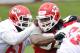 May 24, 2012; Kansas City, MO, USA; Kansas City Chiefs defensive tackle Dontari Poe (92) and offensive lineman Rodney Hudson (61) scrimmage during organized team activities at the Kansas City Chiefs practice facility. Mandatory Credit: Denny Medley-US PRESSWIRE