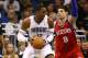 Feb 15, 2012; Orlando, FL, USA; Orlando Magic center Dwight Howard (12) attempts to score as Philadelphia 76ers center Nikola Vucevic (8) defends during the first quarter at Amway Center. Mandatory Credit: Douglas Jones-US PRESSWIRE
