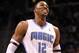 ORLANDO, FL - MARCH 13: Dwight Howard #12 of the Orlando Magic smiles during the game against the Miami Heat at Amway Center on March 13, 2012 in Orlando, Florida. NOTE TO USER: User expressly acknowledges and agrees that, by downloading and or using this photograph, User is consenting to the terms and conditions of the Getty Images License Agreement. (Photo by Sam Greenwood/Getty Images)