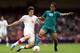 CARDIFF, WALES - AUGUST 01: Giovani dos Santos of Mexico goes for the ball with Timm Klose of Switzerland during the Men's Football first round Group B match between Mexico and Switzerland on Day 5 of the London 2012 Olympic Games at Millennium Stadium on August 1, 2012 in Cardiff, Wales. (Photo by Julian Finney/Getty Images)