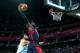 LONDON, ENGLAND - AUGUST 10: LeBron James #6 of United States goes up for a dunk over Carlos Delfino #10 of Argentina in the second half during the Men's Basketball semifinal match on Day 14 of the London 2012 Olympic Games at the North Greenwich Arena on August 10, 2012 in London, England. (Photo by Cameron Spencer/Getty Images)