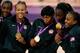 LONDON, ENGLAND - AUGUST 11: (L-R) Gold medalists Tina Charles, Angel McCaughtry #5, Maya Moore #7, Angel McCaughtry #8, Asjha Jones #9 and Tamika Catchings #10 of United States of United States celebrate with their medals during the medal cermony for the Women's Basketball on Day 15 of the London 2012 Olympic Games at North Greenwich Arena on August 11, 2012 in London, England. (Photo by Phil Walter/Getty Images)
