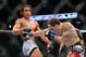 August 11, 2012; Denver, CO, USA; Benson Henderson (left) fights Frankie Edgar (right) during UFC 150 at the Pepsi Center. Mandatory Credit: Ron Chenoy-US PRESSWIRE