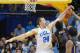March 3, 2012; Los Angeles, CA, USA; UCLA Bruins forward Travis Wear (24) blocks a shot by Washington Huskies guard Tony Wroten (14) in the second half of the game at the Los Angeles Memorial Sports Arena. UCLA won 75-69. Mandatory Credit: Jayne Kamin-Oncea-US PRESSWIRE