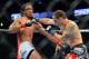 August 11, 2012; Denver, CO, USA; Benson Henderson (left) fights Frankie Edgar (right) during UFC 150 at the Pepsi Center. Mandatory Credit: Ron Chenoy-US PRESSWIRE