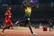 LONDON, ENGLAND - AUGUST 11: Usain Bolt of Jamaica celebates as he crosss the finish line ahead of Ryan Bailey of the United States to win gold and set a new world record of 36.84 during the Men's 4 x 100m Relay Final on Day 15 of the London 2012 Olympic Games at Olympic Stadium on August 11, 2012 in London, England. (Photo by Michael Steele/Getty Images)