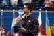 TORONTO, ON - AUGUST 12: Novak Djokovic of Serbia kisses the winner's trophy after beating Richard Gasquet of France 6-3,6-2 in finals of the Rogers Cup Presented By National Bank at Rexall Centre at York University on August 12, 2012 in Toronto, Ontario, Canada. (Photo by Andy Lyons/Getty Images)
