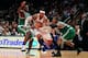 NEW YORK, NY - APRIL 17: Carmelo Anthony #7 of the New York Knicks drives against Brandon Bass #30 and Paul Pierce #34 (R) of the Boston Celtics at Madison Square Garden on April 17, 2012 in New York City. NOTE TO USER: User expressly acknowledges and agrees that, by downloading and/or using this Photograph, user is consenting to the terms and conditions of the Getty Images License Agreement. (Photo by Chris Trotman/Getty Images)