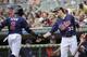 MINNEAPOLIS, MN - AUGUST 12: Justin Morneau #33 of the Minnesota Twins congratulates Denard Span #2 on scoring against the Tampa Bay Rays during the third inning on August 12, 2012 at Target Field in Minneapolis, Minnesota. (Photo by Hannah Foslien/Getty Images)