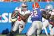 Jan 2, 2012; Jacksonville FL, USA; Ohio State Buckeyes running back Carlos Hyde (34) runs during the fourth quarter of their Gator Bowl game against the Florida Gators at EverBank Field. Florida won 24-17. Mandatory Credit: Phil Sears-US PRESSWIRE