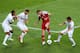 L'VIV, UKRAINE - JUNE 13: Daniel Agger of Denmark is marshalled by Miguel Veloso, Rolando and Joao Pereira of Portugal during the UEFA EURO 2012 group B match between Denmark and Portugal at Arena Lviv on June 13, 2012 in L'viv, Ukraine. (Photo by Alex Livesey/Getty Images)