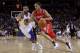 OAKLAND, CA - DECEMBER 20: Kevin Martin #12 of the Houston Rockets dribbles past Acie Law #2 of the Golden State Warriors at Oracle Arena on December 20, 2010 in Oakland, California. NOTE TO USER: User expressly acknowledges and agrees that, by downloading and or using this photograph, User is consenting to the terms and conditions of the Getty Images License Agreement. (Photo by Ezra Shaw/Getty Images)