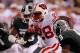 INDIANAPOLIS, IN - DECEMBER 03: Montee Ball #28 of the Wisconsin Badgers scores his second 6-yard rushing touchdown in the first quarter against Isaiah Lewis #9 of the Michigan State Spartans during the Big 10 Conference Championship Game at Lucas Oil Stadium on December 3, 2011 in Indianapolis, Indiana. (Photo by Gregory Shamus/Getty Images)