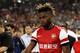 Arsenal midfielder Alex Song is on Barcelona's radar, but he's "happy" with Arsenal.