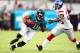 Aug 10, 2012; Jacksonville FL, USA; Jacksonville Jaguars wide receiver Mike Thomas (80) runs for yardage after a reception as New York Giants defensive back Antrel Rolle (26) attempts to make the tackle during the first quarter at EverBank Field. Mandatory Credit: Douglas Jones-US PRESSWIRE