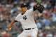 NEW YORK, NY - AUGUST 14: Hiroki Kuroda #18 of the New York Yankees piches against the Texas Rangers at Yankee Stadium on August 14, 2012 in the Bronx borough of New York City. (Photo by Mike Stobe/Getty Images)