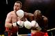 BELFAST, NORTHERN IRELAND - MAY 05: Paul McCloskeyis caught by DeMarcus Corely during their Light Welterweight bout at King's Hall on May 5, 2012 in Belfast, Northern Ireland. (Photo by Scott Heavey/Getty Images)