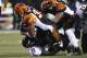 CINCINNATI, OH - JANUARY 01: Cedric Benson #32 of the Cincinnati Bengals runs over Bernard Pollard #31 of the Baltimore Ravens during their game at Paul Brown Stadium on January 1, 2012 in Cincinnati, Ohio. The Ravens defeated the Bengals 24-16. (Photo by John Grieshop/Getty Images)