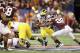 NEW ORLEANS, LA - JANUARY 03: Denard Robinson #16 of the Michigan Wolverines runs the ball against Alonzo Tweedy #28 of the Virginia Tech Hokies during the Allstate Sugar Bowl at Mercedes-Benz Superdome on January 3, 2012 in New Orleans, Louisiana. (Photo by Matthew Stockman/Getty Images)