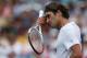 MASON, OH - AUGUST 16: Roger Federer of Switzerland wipes sweat from his forehead against Bernard Tomic of Australia during day six of the Western & Southern Open at Lindner Family Tennis Center on August 16, 2012 in Mason, Ohio. (Photo by Nick Laham/Getty Images)