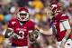 BATON ROUGE, LA - NOVEMBER 25: Tyler Wilson #8 directs Joe Adams #3 of the Arkansas Razorbacks to the right place during a game against the LSU Tigers at Tiger Stadium on November 25, 2011 in Baton Rouge, Louisiana. The Tigers defeated the Razorbacks 41 to 17. (Photo by Wesley Hitt/Getty Images)