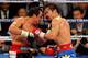 LAS VEGAS, NV - NOVEMBER 12: Juan Manuel Marquez (L) and Manny Pacquiao battle in the 10th round of their WBO world welterweight title fight at the MGM Grand Garden Arena November 12, 2011 in Las Vegas, Nevada. Pacquiao retained his title with a majority decision victory. (Photo by Ethan Miller/Getty Images)
