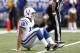 INDIANAPOLIS, IN - AUGUST 12: Andrew Luck #12 of the Indianapolis Colts gets up after being knocked down while passing against the St. Louis Rams during a preseason NFL game at Lucas Oil Stadium on August 12, 2012 in Indianapolis, Indiana. (Photo by Joe Robbins/Getty Images)