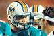 August 10, 2012; Miami Gardens, FL, USA; Miami Dolphins quarterback Ryan Tannehill (17) talks with the coaching staff during a break in the action in the second half of the game against the Tampa Bay Buccaneers at Sun Life Stadium. Tampa Bay won the game 20-7. Mandatory Credit: Brad Barr-US PRESSWIRE